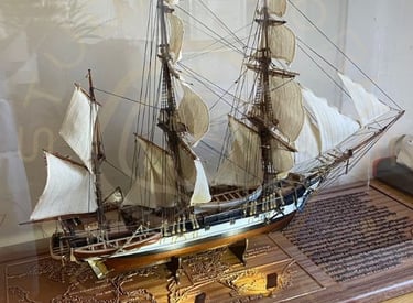 Display base for a model ship display showing integrated lighting