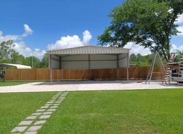A metal carport structure under construction.