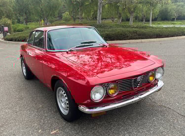 An image of a red 1974 Alfa Romeo GTV 2000