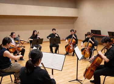 A cozy music classroom with students playing various instruments and a teacher guiding them warmly.