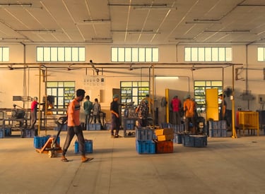 The inside of a company Promed Devices. Workers are actively walking and doing job