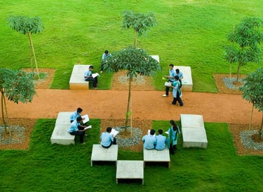 BIT Polytechnic students sitting on concrete benches