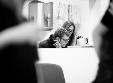 A man and woman reading something