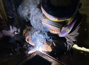 a man welding a peice of metal