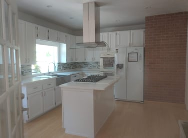 a remodeled kitchen with a stove top oven