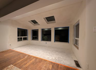 A remolded room with windows