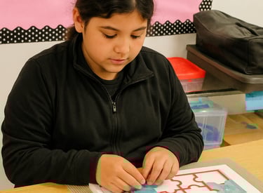 blind student interacts with a tactile puzzle, spatial orientation, O&M, Braille