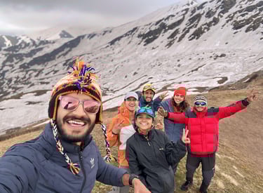 Adventure travelers hiking through snowy trails in Himachal Pradesh