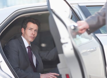 Executive is in a car