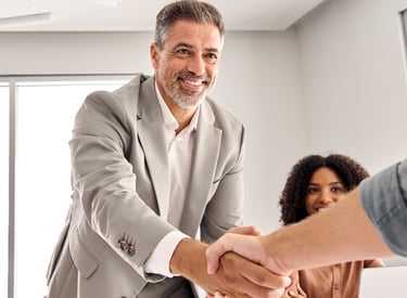 Personal Assistant and Executive are shaking hands