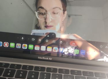 Riya taking a picture of her laptop screen