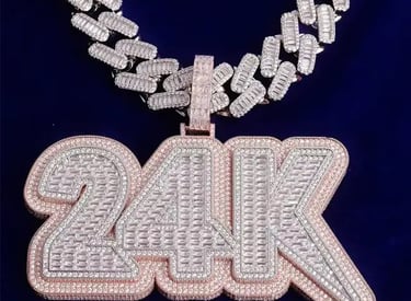 A custom VVS Moissanite pendant created for a A client that reads, "24k" 