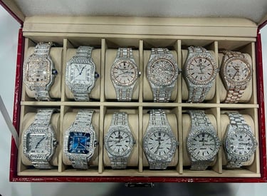 A group shot of a few Iced Out Bust Down watches IceCold has to offer
