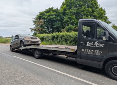 a car being towed away from the road