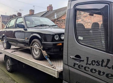 BMW Car on the back of a recovery truck
