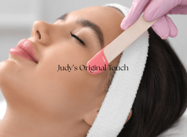 a woman getting her eyebrows wax