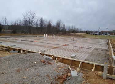 a large concrete slab being built into a foundation