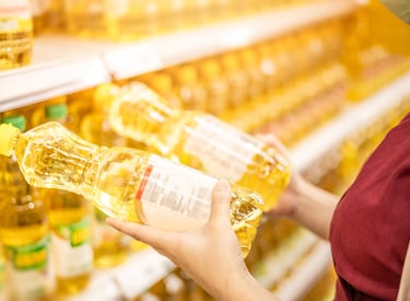 A shopper picking a product off a shelf