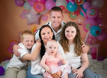 a family posing for a photo in a photo