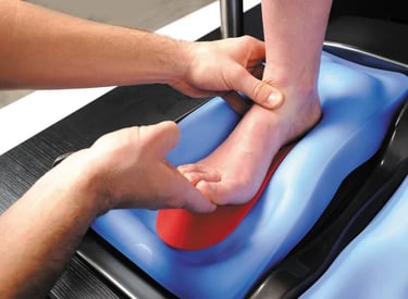 Close-up of a bike fitter forming custom insoles