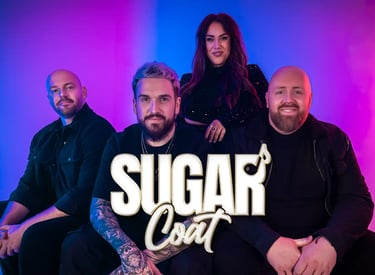 a group of people sitting on a couch with a man in a black shirt