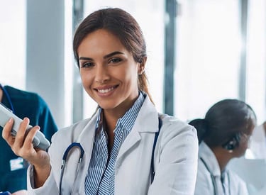 Doctor in a white coat and a nurse in a green scrub