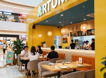 Cozy interior of a cafe with warm lighting and customers enjoying coffee.