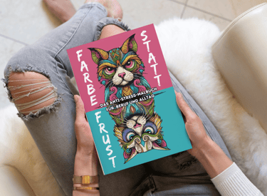 a person sitting on a couch with a book about a cat