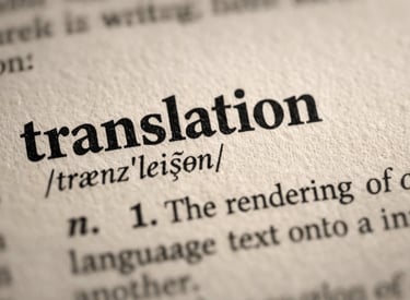 Close-up of the word translation and its phonetic spelling in a dictionary with a shallow depth of field.