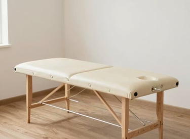 A woman in athletic wear is sitting on the floor of a gym, engaging with suspension training ropes attached to the wall. She appears to be stretching or exercising, while a man in a t-shirt is standing nearby, possibly offering guidance or instructions. The gym setting includes exercise equipment and natural light coming through large windows.