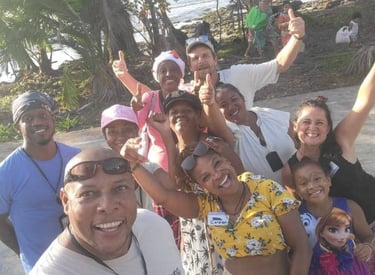 community group of people standing around a man holding a camera