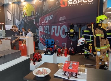 a group of people standing around a table with a laptop and Rafs the cafs foam generator
