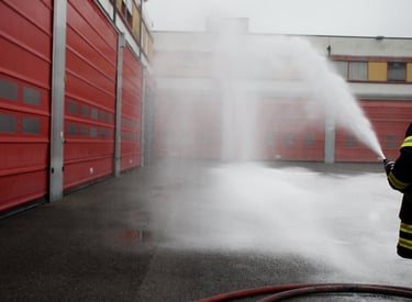 a firefighter is using a smoothbore nozzle to spray cafs type firefighting foam