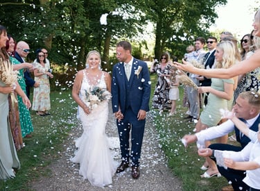 Bride and groom smiling at camera during wedding photography session