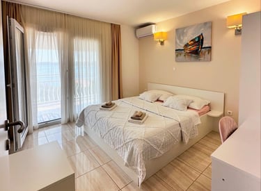 room with bed, closet, window and chair