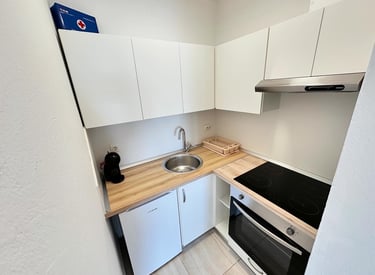 Kitchen with coffe machine and cooking space