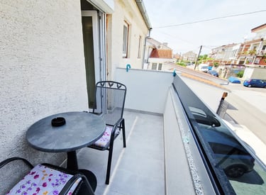 balcony with table and chairs