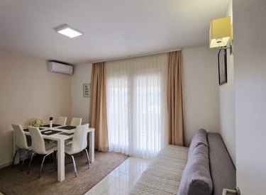dining room with chairs and couch and windows