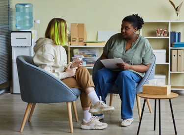 A social worker and a service user in a meeting