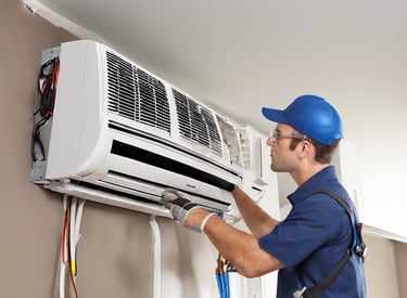man in orange hard hat holding red plastic bag