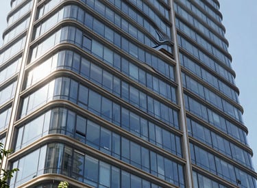 Modern glass and aluminum facade reflecting sunlight in a Riyadh urban setting