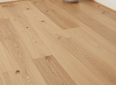 A cozy living room featuring new flooring and custom built-ins.