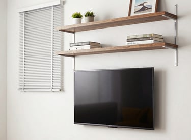Before and after shots of a home office renovation with fresh paint and new desk.