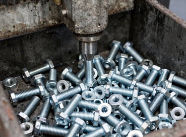 Workshop scene showing skilled workers assembling metal components.