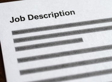 Close-up of hands collaborating over workplace documents filled with colorful notes.