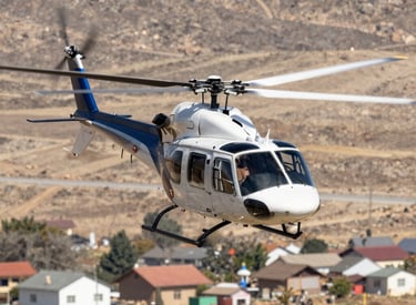 a helicopter flying in the sky with a half moon in the background