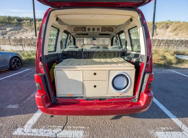 2nd prototype WOODSYBOX with drawers and speaker installed in a red minivan.