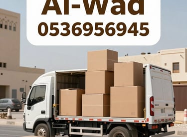 A professional team carefully loading furniture into a moving truck in Riyadh.