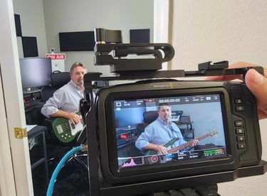 instructor demonstrating professional camera setup during hands-on film education workshop