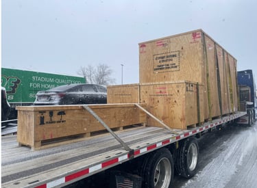 A VK Logistics truck loaded with freight driving along a highway at snowy.